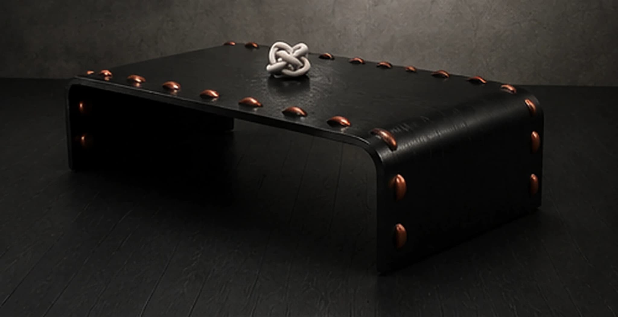 The Leather Stud Coffee Table, a returning three-quarter view